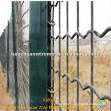 Galvanized silver surrounding land wave fence